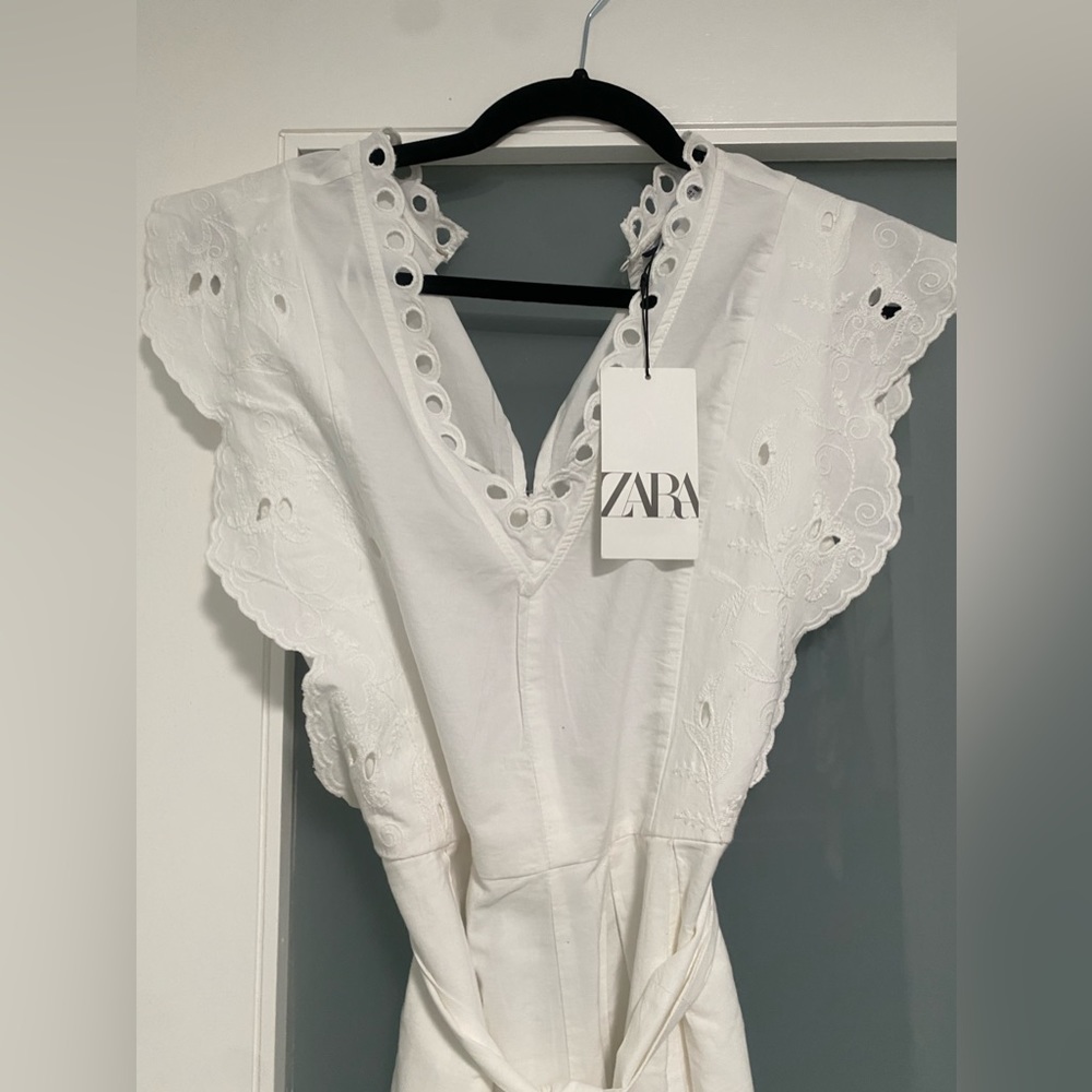 NWT Openwork Embroidery Romper with Bow Belt. Color is white. Size is small. - Picture 13 of 15
